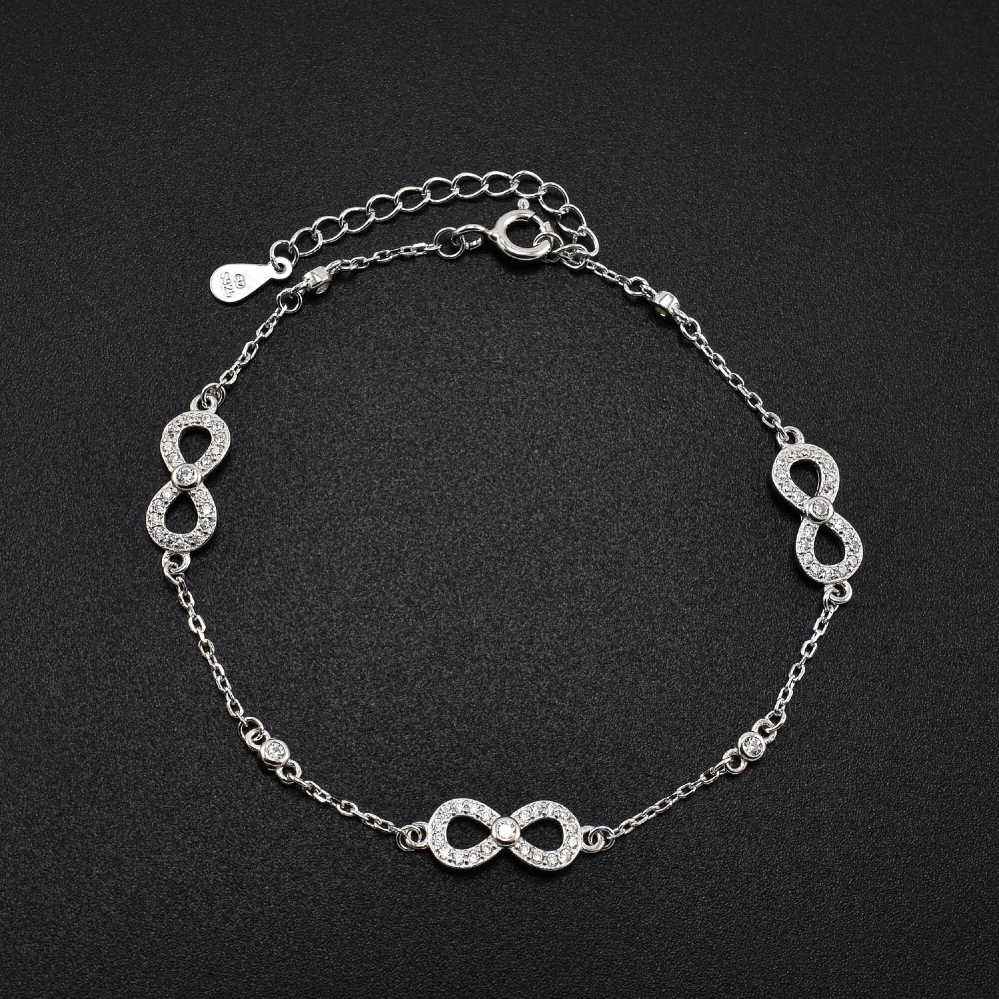 Bratara dama din argint cu accesorii in forma de infinit acoperite cu cristale swarovski