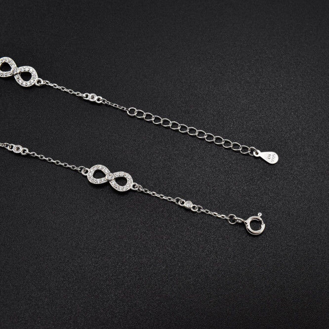 Bratara dama din argint cu accesorii in forma de infinit acoperite cu cristale swarovski